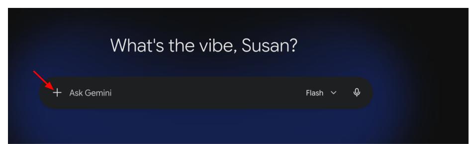 Screenshot of a digital assistant interface, Google Gemini, with a dark blue background and text prompt "What's the vibe, Susan?" A black input bar labeled "Ask Gemini" with a red arrow pointing to a plus sign on the left.